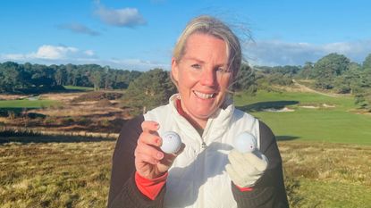 Carly Cummins holds two different golf balls