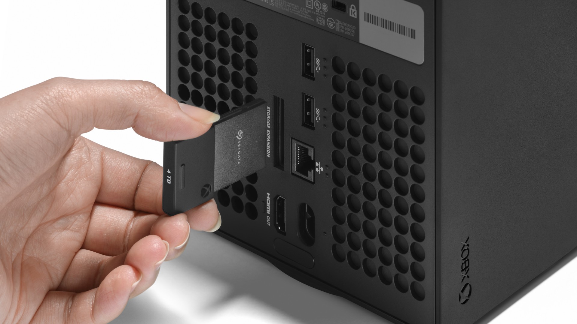 A Seagate expansion card being inserted into an Xbox Series X console