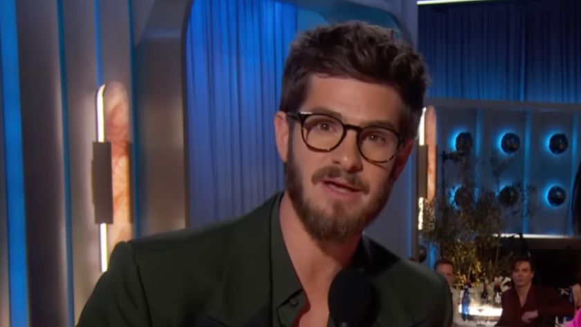 Andrew Garfield presenting Best Performance by a Female Actor in a Motion Picture—Musical or Comedy at the 82nd annual Golden Globes in his viral glasses.