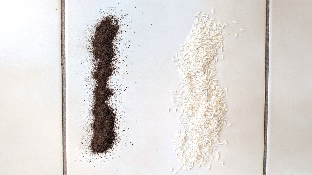 Coffee grounds and rice on hard floor before testing with Shark PowerDetect Speed vacuum cleaner
