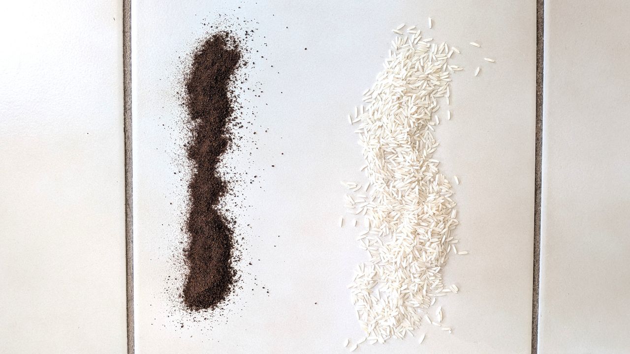 Coffee grounds and rice on hard floor before testing with Shark PowerDetect Speed vacuum cleaner