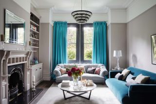 living room with grey walls and turquoise curtains