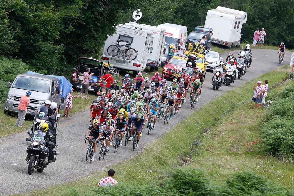 The peloton climbs during stage 12.