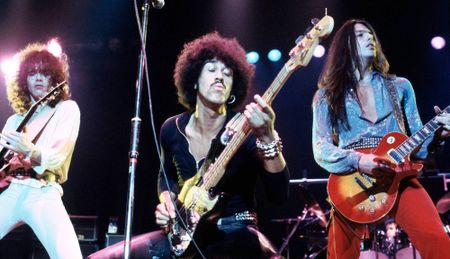 (from left) Thin Lizzy's Brian Robertson, Phil Lynott, and Scott Gorham perform onstage