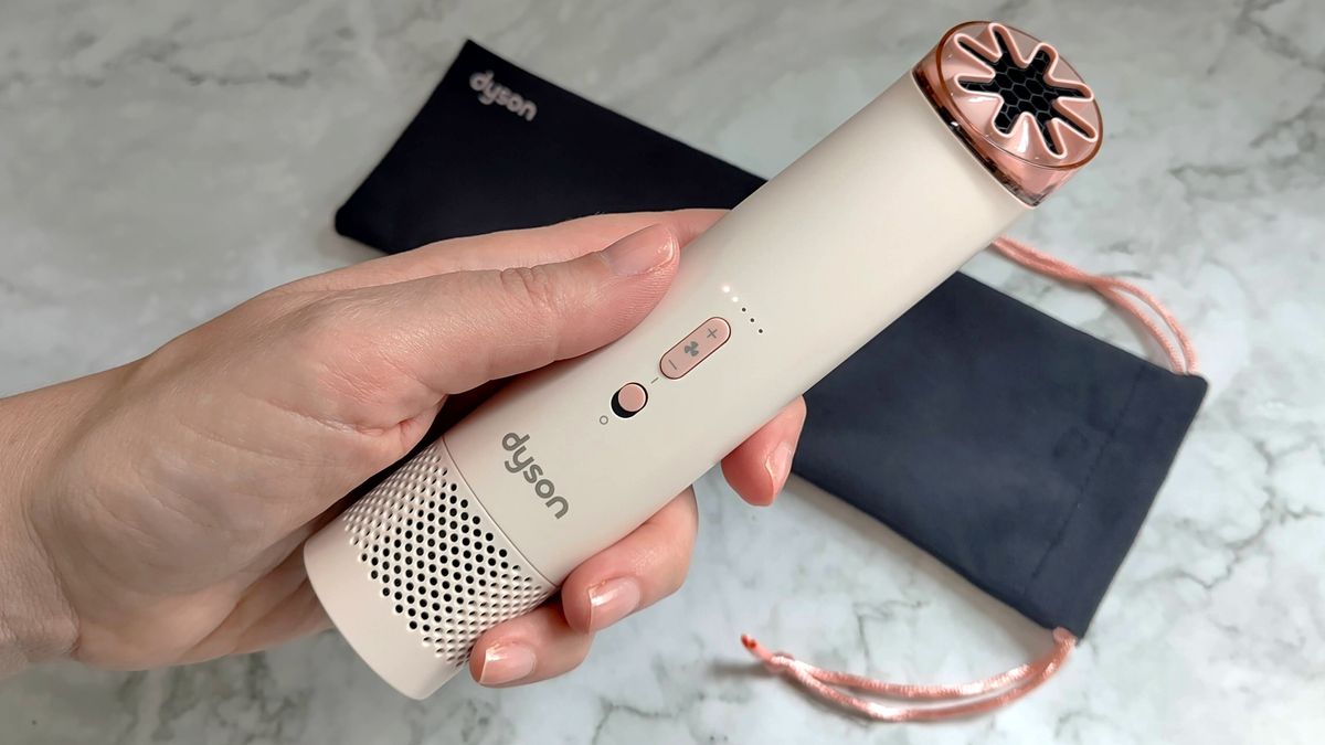 Dyson HushJet Mini Cool fan in woman's hand