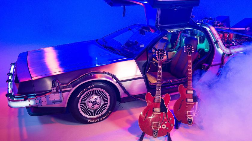 Gibson and Epiphone&#039;s new Back to the Future ES-345s are photographed against the DeLorean as used by Dr Emmett Brown in the movie
