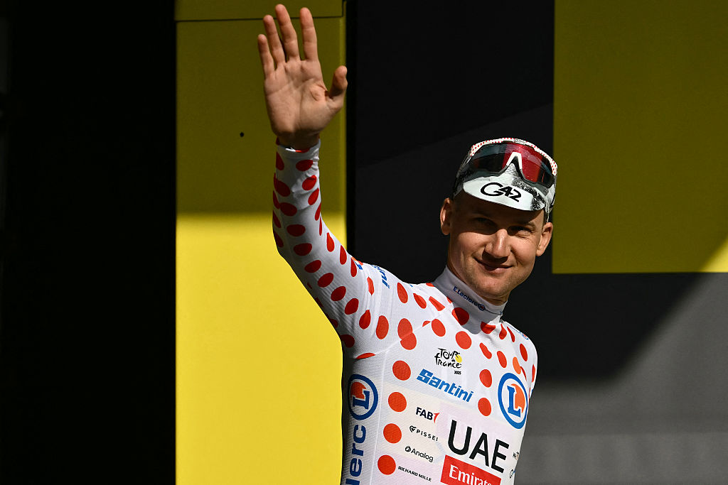UAE Team Emirate - XRG team's Belgian rider Tim Wellens celebrates on the podium with the best climber's polka dot (dotted) jersey after the 3rd stage of the 112th edition of the Tour de France cycling race, 178.3 km between Valenciennes and Dunkerque (Dunkirk), Northern France, on July 7, 2025. (Photo by Marco BERTORELLO / AFP) (Photo by MARCO BERTORELLO/AFP via Getty Images)