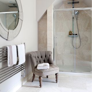modern bathroom with triton showers room and chair