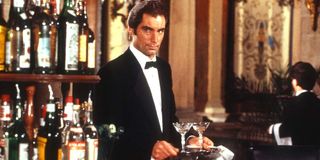 License to Kill Timothy Dalton carries a tray of drinks cautiously
