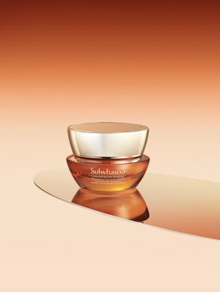 a bottle of sulwhasoo ginseng eye cream in front of a backdrop