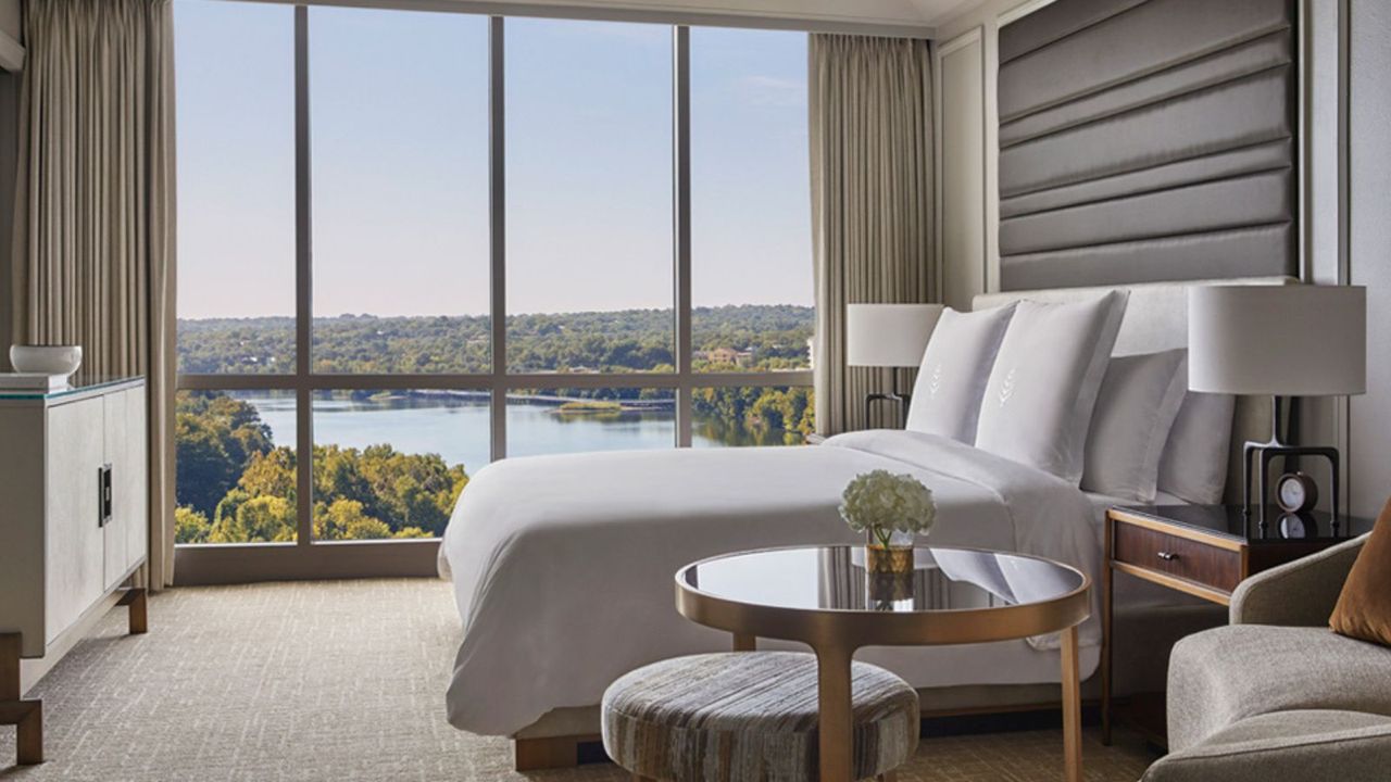 A bedroom with a park view at the Four Seasons Hotel.