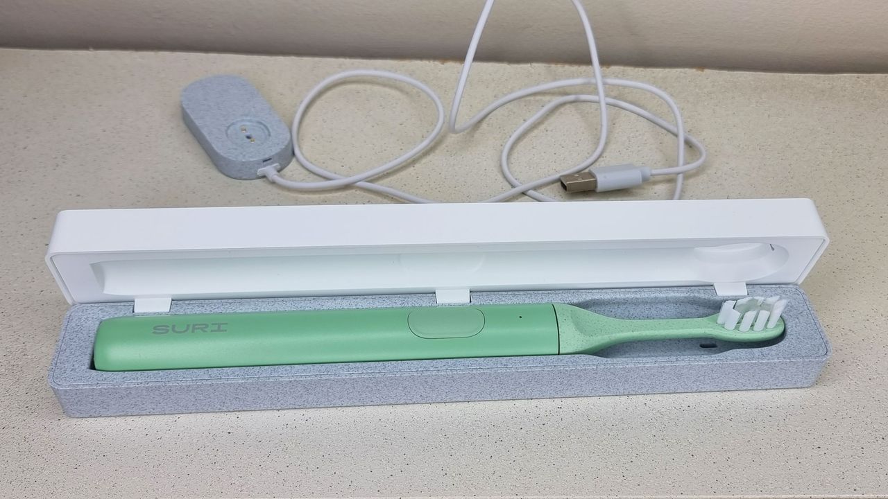 Suri electric toothbrush in a cleaning case