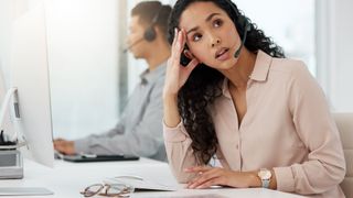 Woman annoyed on business call headset