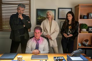 (L to R) Pierce Brosnan, Adam Devine (with pink on his face), Ellen Barkin and Nina Dobrev in The Out-Laws