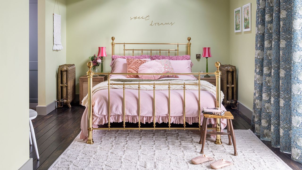 green bedroom with brass bed and pink bedding