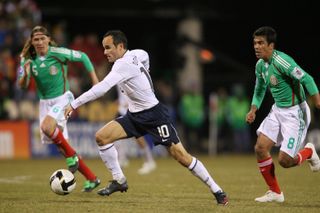 Landon Donovan runs with the ball in a World Cup qualifier against Mexico in 2009.