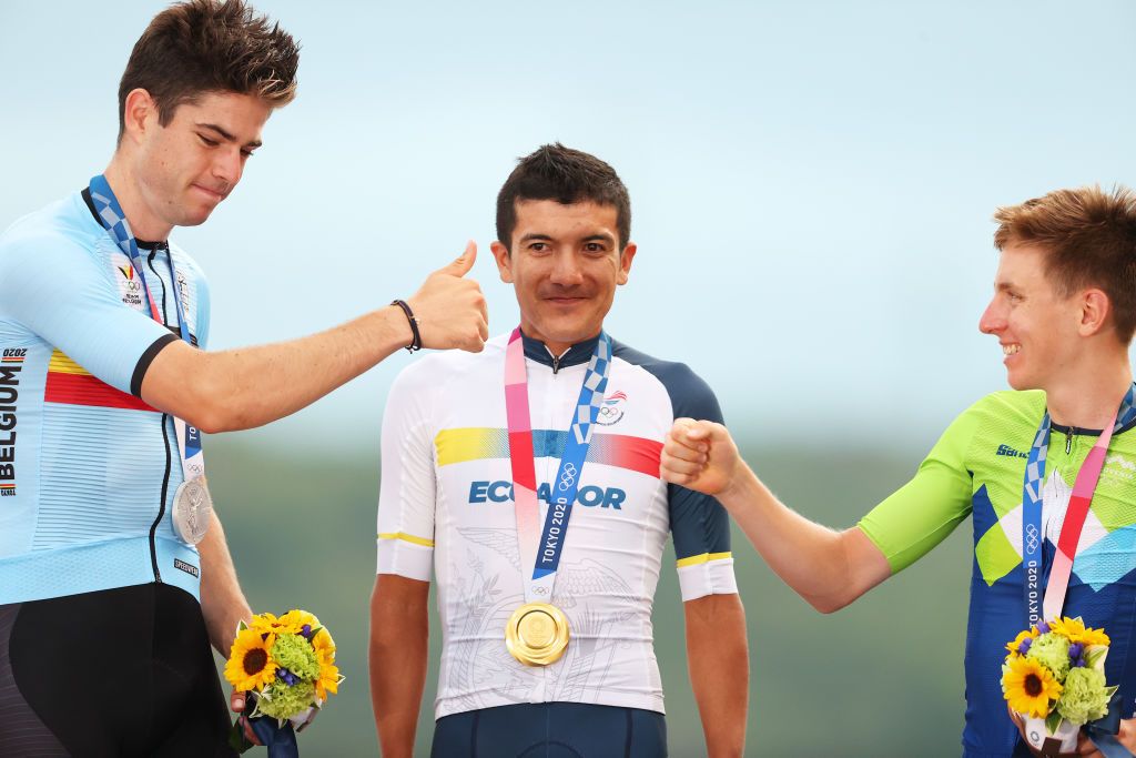 OYAMA JAPAN JULY 24 LR Silver medalist Wout van Aert of Team Belgium gold medalist Richard Carapaz of Team Ecuador and bronze medalist Tadej Pogacar of Team Slovenia pose on the podium during the medal ceremony during the Mens road race at the Fuji International Speedway on day one of the Tokyo 2020 Olympic Games on July 24 2021 in Oyama Shizuoka Japan Photo by Michael SteeleGetty Images