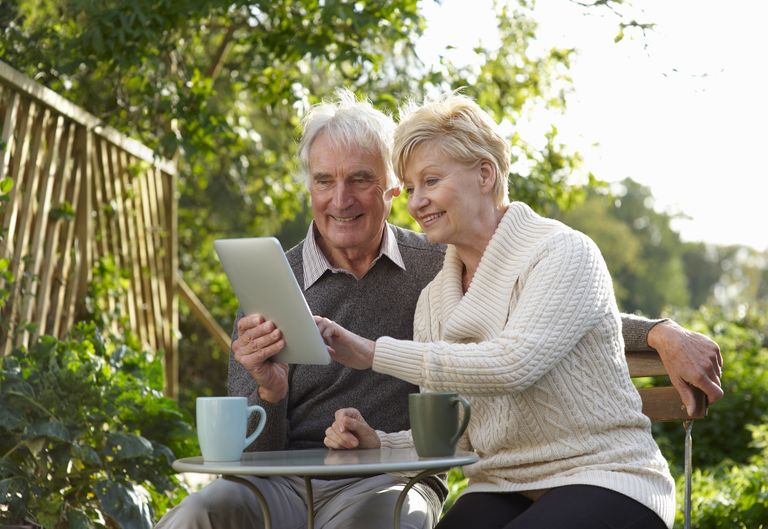 elderly couple on a tablet