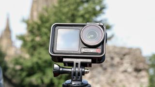 The DJI Osmo Action 5 Pro against an outdoors background