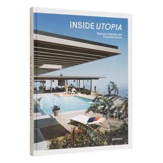 A cutout of a book with a futuristic home on the cover 