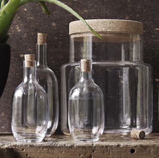 glass bottle with cork and glass jar