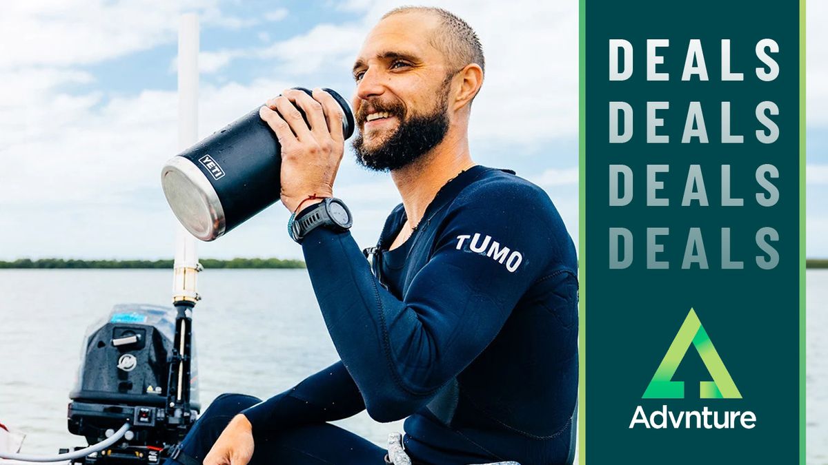 Man on boat drinking from Yeti bottle