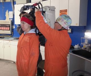 Journalist Elizabeth Howell gets suited up for a simulated Marswalk at Utah's Mars Desert Research Station.