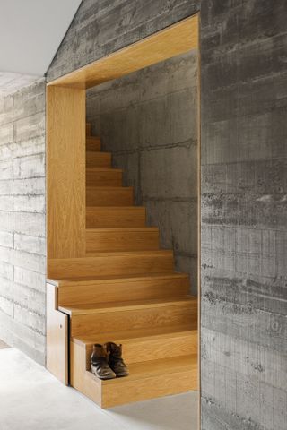 Sculptural staircase inside Portuguese farm house by NaMora House