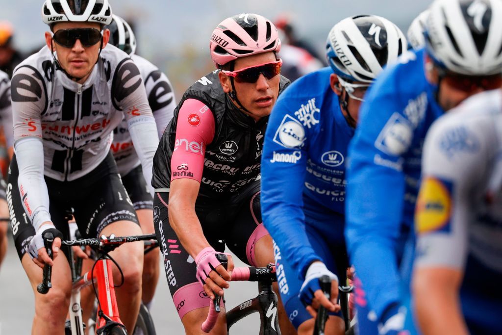 Team Deceuninck rider Portugals Joao Almeida 2L wearing the overall leaders pink jersey rides during the 9th stage of the Giro dItalia 2020 cycling race a 208kilometer route between San Salvo and Roccaraso on October 11 2020 Photo by Luca Bettini AFP Photo by LUCA BETTINIAFP via Getty Images
