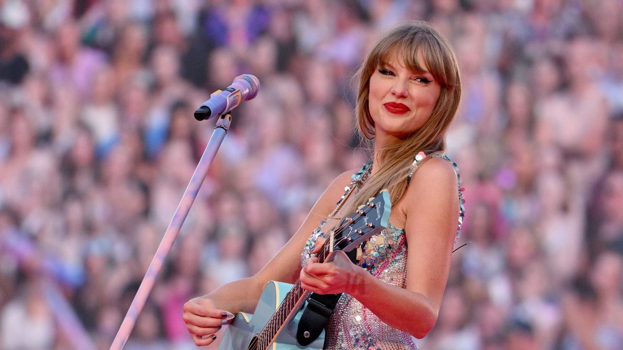 Taylor Swift performs on stage during her Eras tour in Kansas City