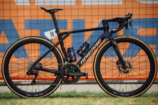 Oscar Onley's Lapierre bike leaning against a fence at the Tour Down Under