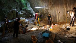Archaeologists excavate and document the burial site at Arma Veirana.