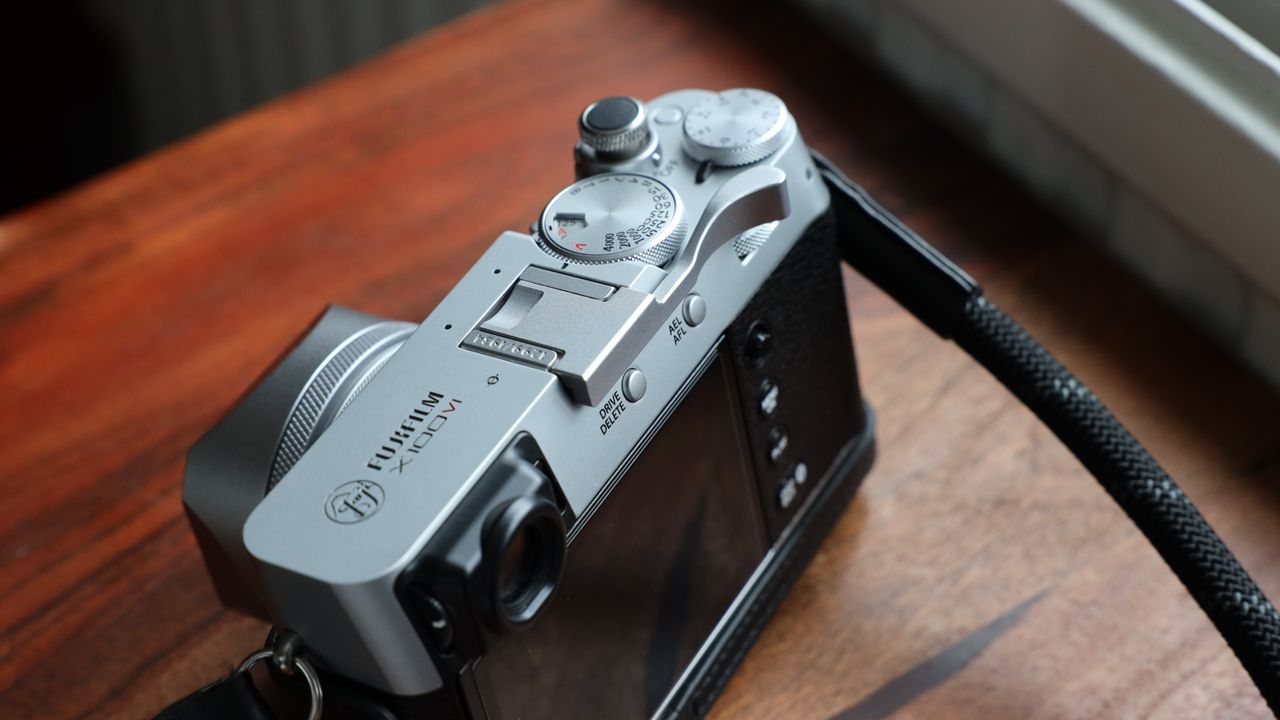 Fujifilm X100VI camera on a wooden table