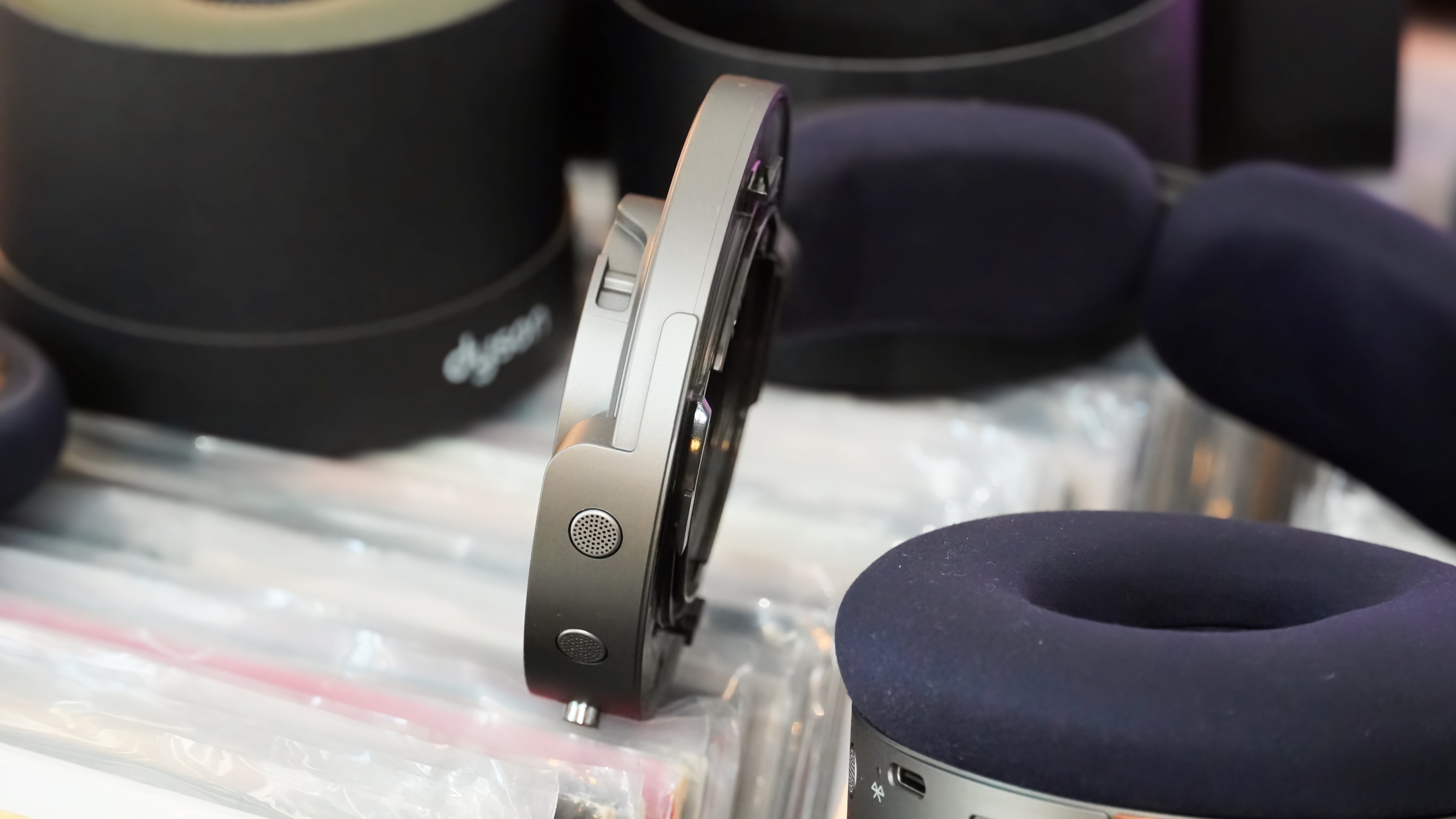 The Dyson OnTrac headphones with a mix of silver and copper caps.