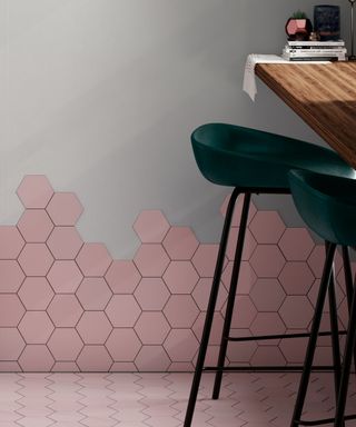 Tile Mountain pink Kromatika Rose Hexagonal Tiles on floor to wall in a kitchen with an island and green velvet bar stools