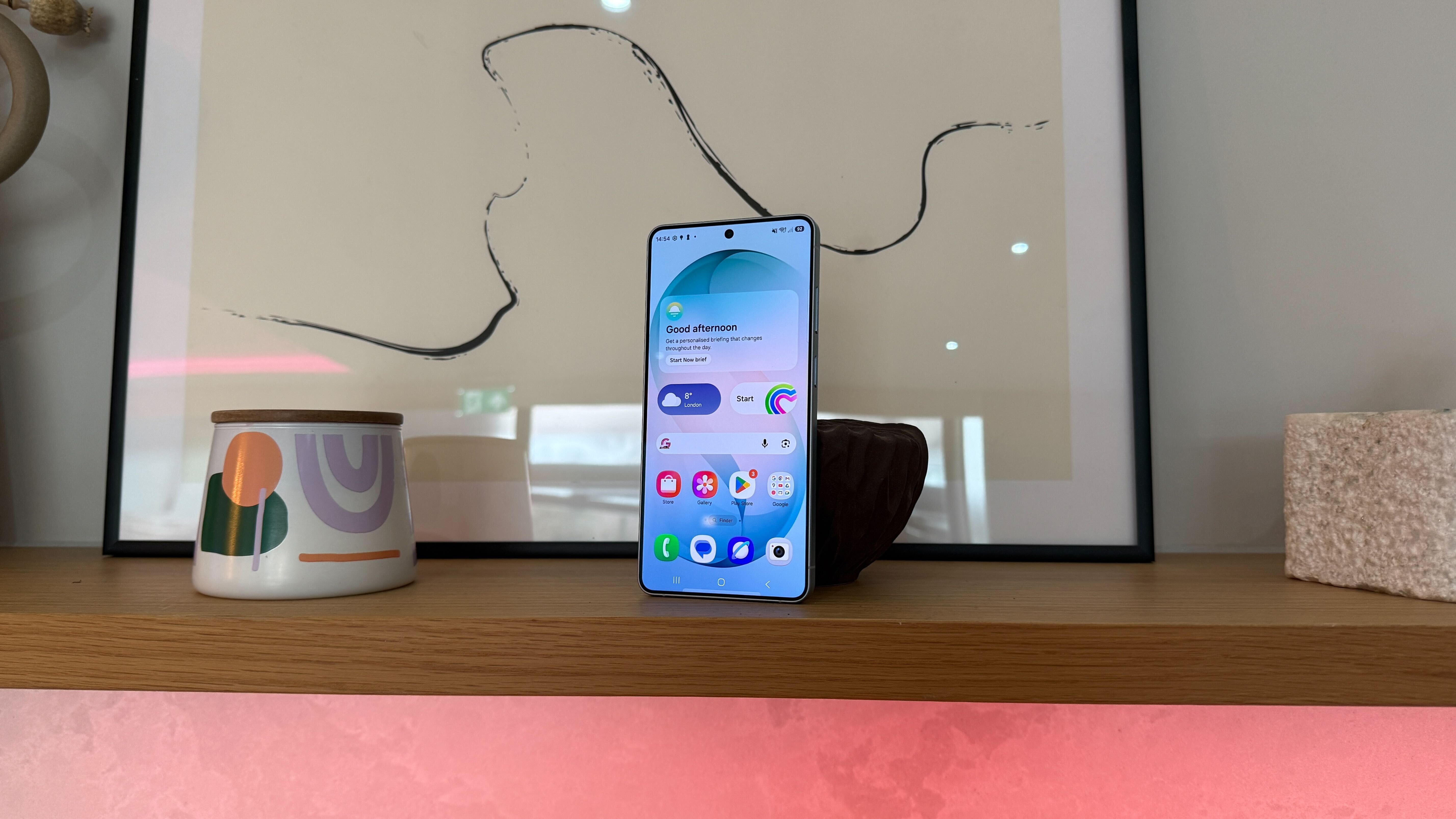 A Samsung Galaxy S26 Ultra smartphone in a modern home environment