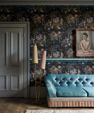 Room decorated with chintz wallpaper with a vintage sofa edged with Samuel & Sons Bagatelle Tassel Skirt Fringe