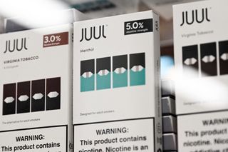 JUUL Labs Inc. Virginia tobacco and menthol flavored vaping e-cigarette products are displayed in a convenience store.