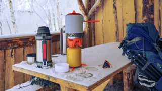 Camping stove inside wooden hut