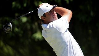 Scottie Scheffler of the United States plays his shot from the fourth tee during a practice round prior to the PGA Championship at Aronimink Golf Club