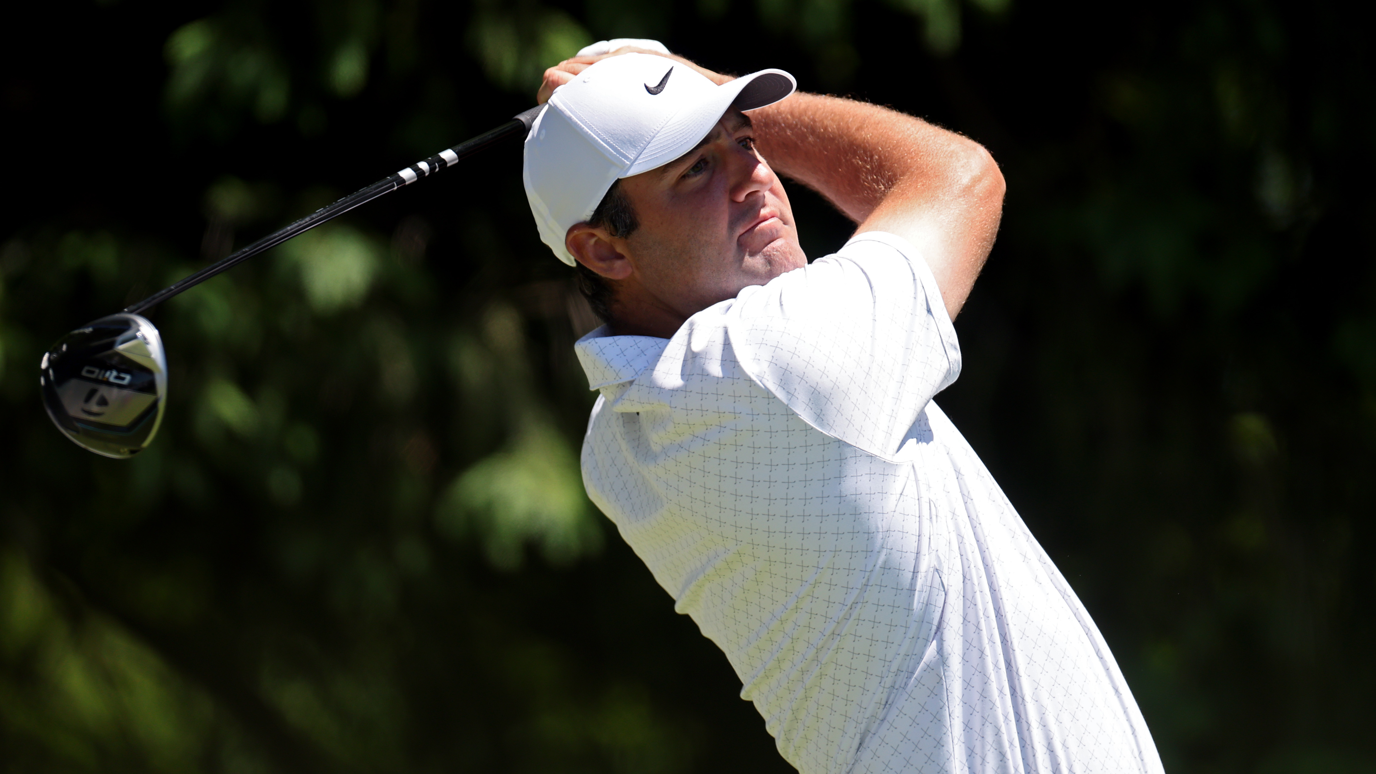 Scottie Scheffler of the United States plays his shot from the fourth tee during a practice round prior to the PGA Championship at Aronimink Golf Club