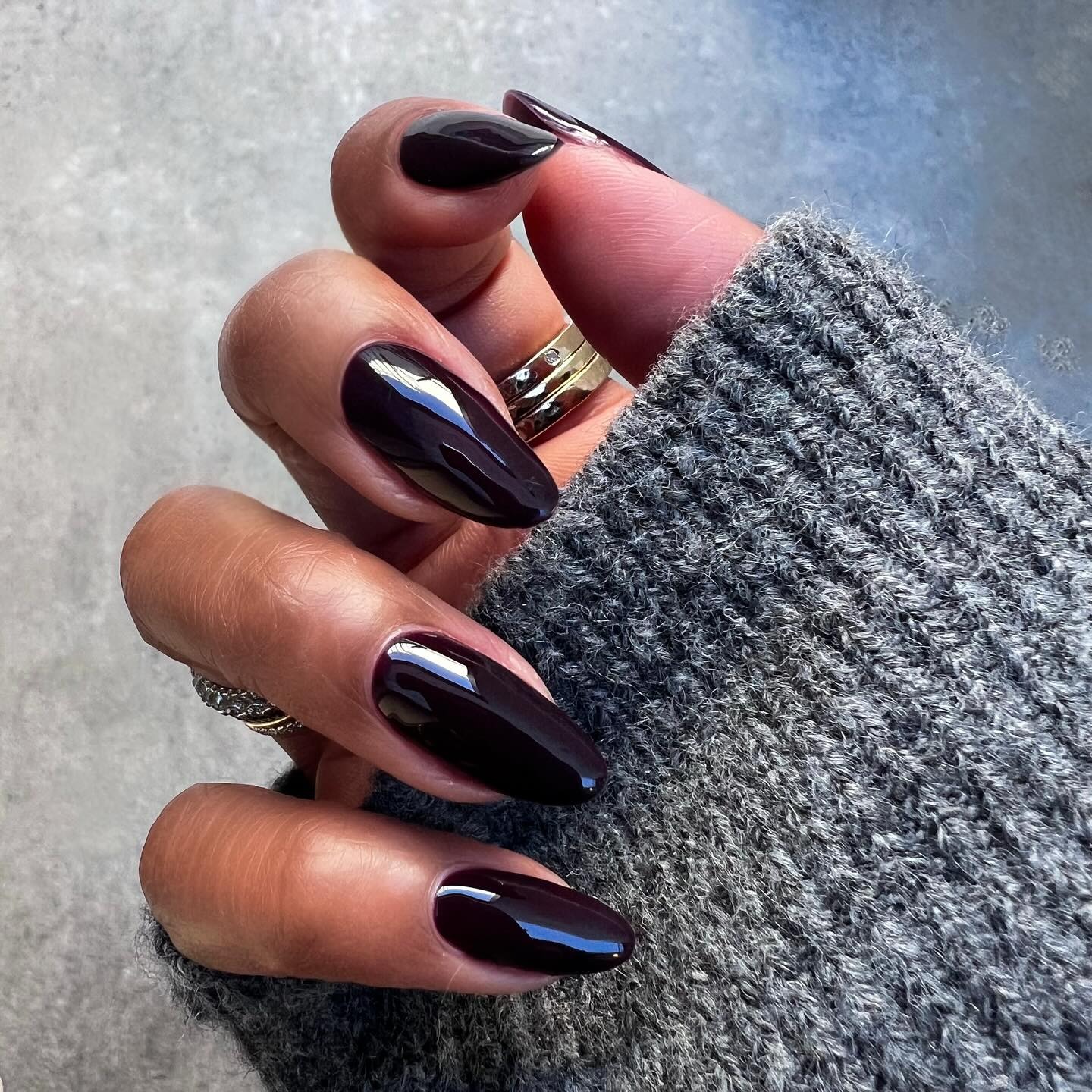 A long, almond-shaped ebony manicure