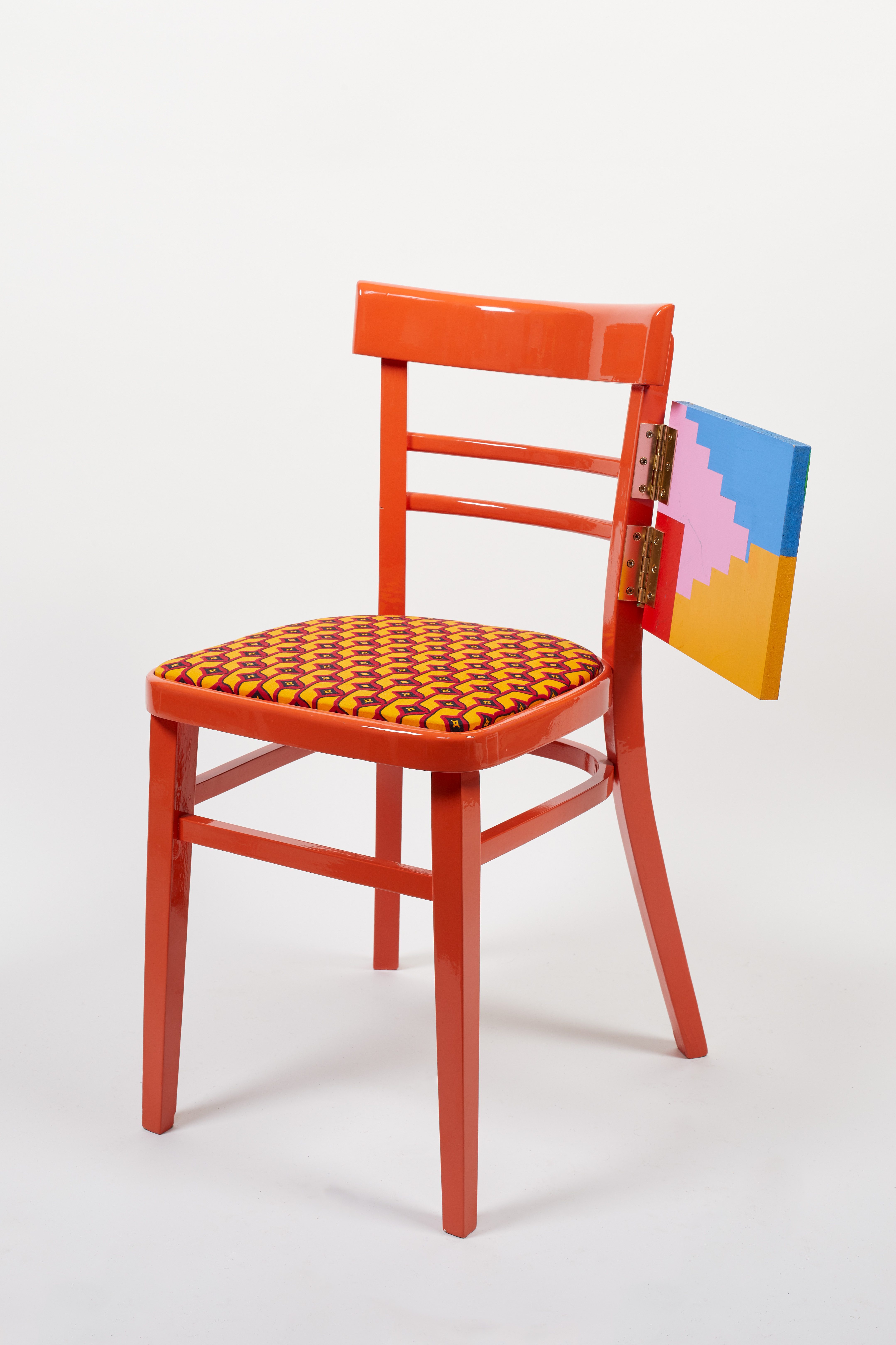 Yinka Ilori chair in bright orange