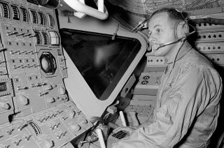 NASA astronaut Philip Chapman undergoes training in the Apollo Lunar Module Simulator in 1968.