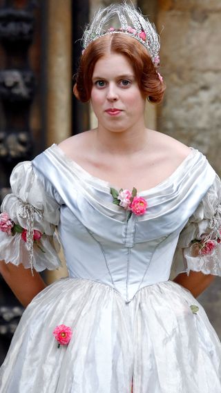 Princess Beatrice poses for photographs, whilst wearing period costume, during a break in filming on the set of 'The Young Victoria'