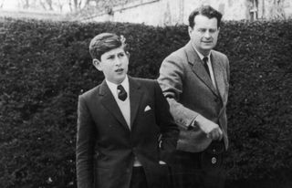 Prince Charles arrives at Gordonstoun School in Scotland for his first term, and is shown around by Captain Iain Tennant, chairman of the board of governors