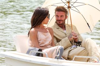 David and Victoria Beckham gaze at each other on a boat