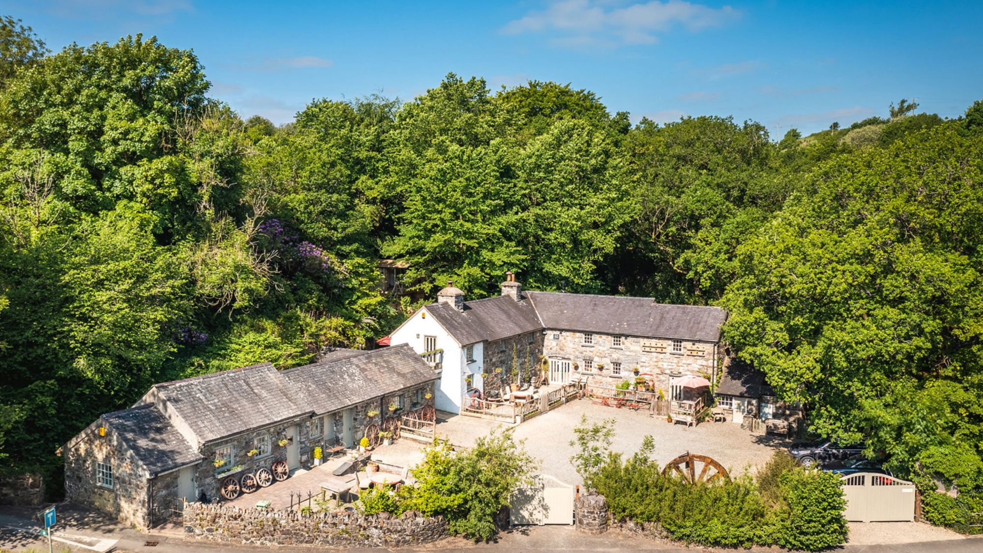 Bucolic mill house with approximately 30 acres of grounds.