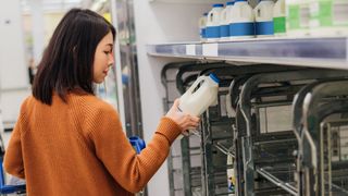 woman shopping for a pint of milk