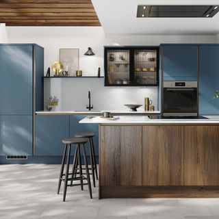 Blue and dark wood kitchen with matt slab cupboard doors
